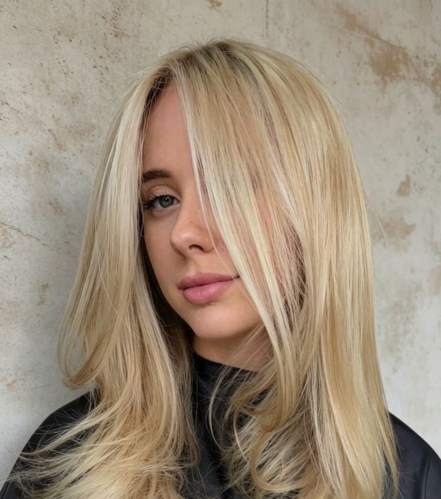 Buttery blonde face-framing layers